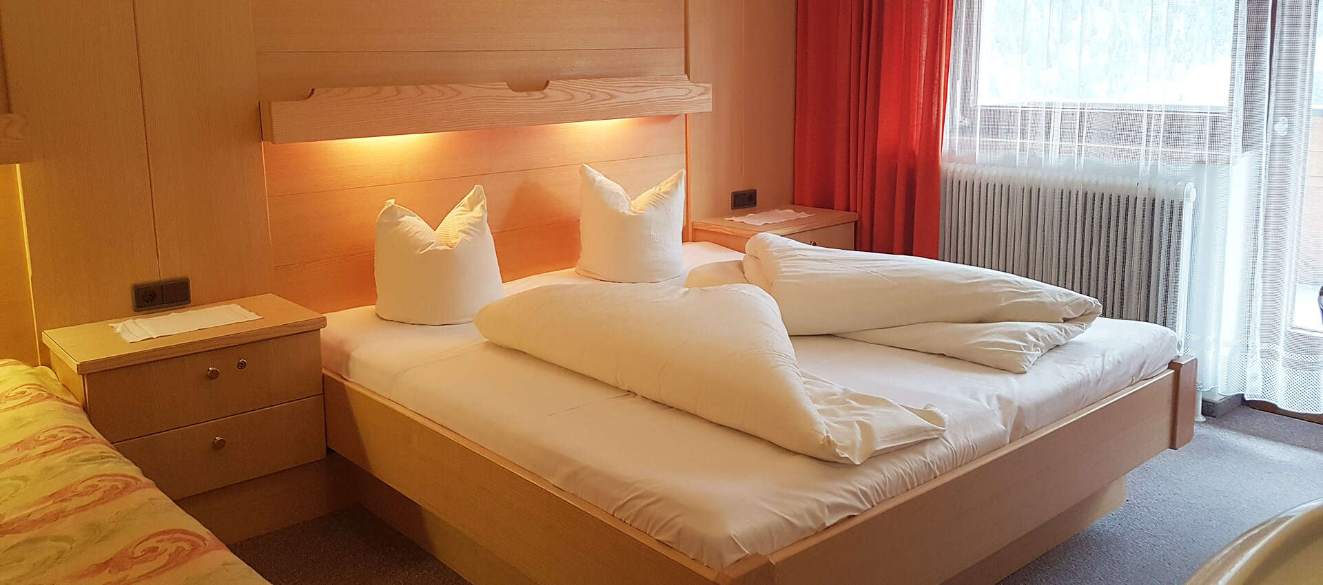 Dreibettzimmer im Appartement Rosmarie